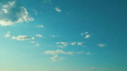 Spring Day With A Clear Blue Sky And Fluffy White Clouds. Day With Warm Sunshine Combined With Cool...