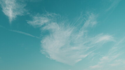 Cirrostratus. Blue sky with clouds and sun. Beautiful sky with clouds background.