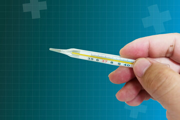 Hand holding a thermometer Measure body temperature,5 basic medical vital signs, vital signs...