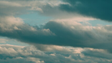 Obraz premium Clouds in different shades. Clouds during sunset. Panoramic view.