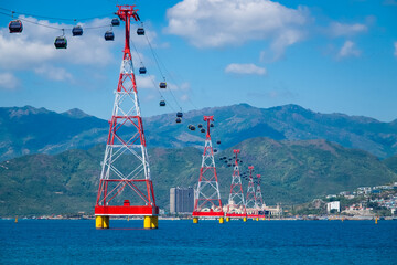 Aerial cable car carriage over ocean in Nha Trang, Vietnam - Powered by Adobe