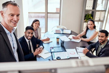 Business, man and boardroom with meeting for teamwork, collaboration and feedback on company growth as leader. Ceo, boss and people at office with smile for strategy, report and progress as partner