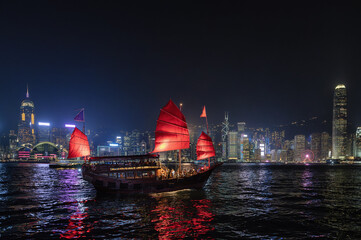 Hong Kong City Skyline and Victoria Harbour with Junk Boats and Ferry