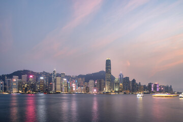 Hong Kong City Skyline and Victoria Harbour with Junk Boats and Ferry