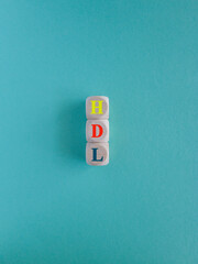 HDL - High-density lipoprotein acronym with marker. Concept words HDL on wooden cubes. Beautiful...