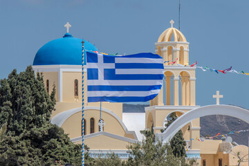 Santorini, Greece, May 4, 2024. Oia. Facade of the Orthodox church, Agios Giorgios, with a Greek...