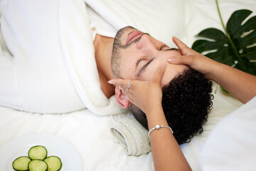 Skincare, face massage and man in spa with relax for vegan beauty, skin glow and dermatology. Male...