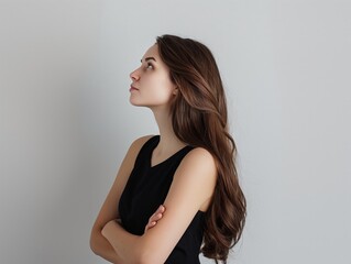 Profile of a serene young woman looking upwards, symbolizing reflection.