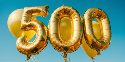 The image displays shiny golden balloons in the shape of the number 500, soaring against a clear blue sky background