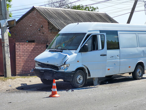 Road car accident. The car crashed. The car damege. The wheel came off. Broken minibus. Overturned car.  The car overturned. The car rolled over onto its roof. 
