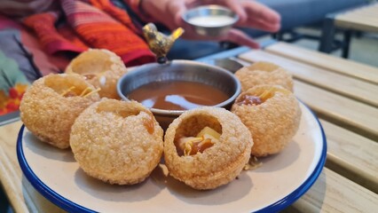 Famous street food of Pakistan and India, Gol gappay or pani puri. © zeeshan