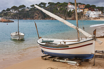 Obraz premium Traditional fishing boats. Mediterranean coast. Llafranc village. Catalonia, Spain