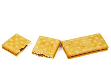 Cracker sandwiches with chocolate filling isolated on white background.