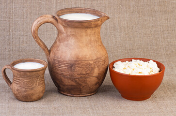 Clay jug and cup of milk and curds