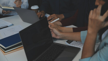 Team of business people working together in the meeting room office, teamwork background charts and...