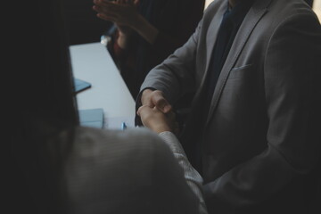 Business people shaking hands after meeting. colleagues handshaking after conference. Greeting...