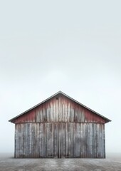 Rustic wooden barn in a pastoral countryside setting with copy space above.