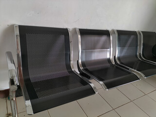 Selective focus. Chairs waiting for patients to seek treatment at one of the puskesmas are made of...