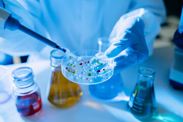 Scientist mixing chemical liquids in the chemistry lab. Researcher working