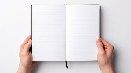 two hands holding an open notebook with blank lined pages, against a white background