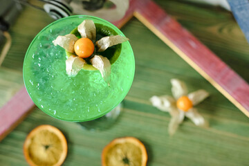 Close Up of Green Drink With Oranges