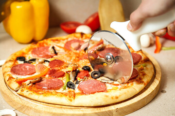 Pizza Being Cut With a Pizza Cutter