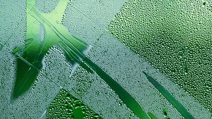 Abstract pattern of water drops on glass