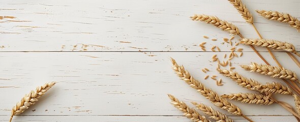 Obraz premium Abstract background with wheat ears on a white wooden table