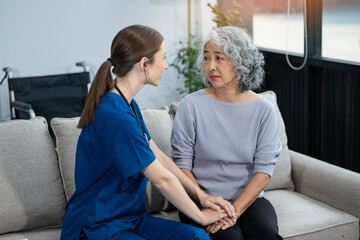 Female doctors shake hands with patients encouraging each other  To offer love, concern, and...