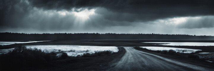 Dramatic Dark Road Under Stormy Skies with Glimmers of Sunlight