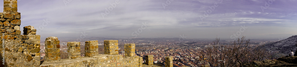 Wall mural 4 February 2024 Afyonkarahisar Turkey. Afyonkarahisar castle and Afyon cityscape from castle on a cloudy winter day