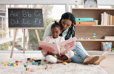 House, girl and mother reading a book, relax and bonding together with language, learning and...