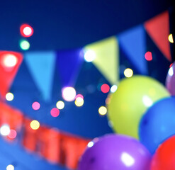 Defocused party background with balloons and flags