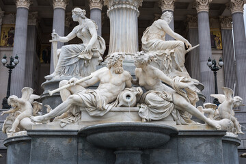Obraz premium The base of the Athena Fountain at the Austrian Parliament, Vienna, Austria.