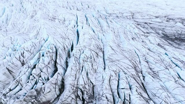Cracked and ragged frozen glacier ice shove with crevasses in Iceland.