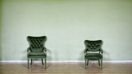 Green wall chair looks comfortable and minimalist.