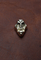 bag and belts metal accessories on leather background