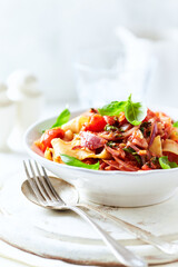 Spaghetti Pasta with Vegetables and fresh Basil on bright wooden Background.	