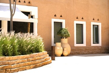 View on clay pots and clay walls of heritage village in Saudi Arabia