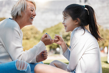 Grandma, girl and happy with pinky promise in park for bonding, support and care on child...