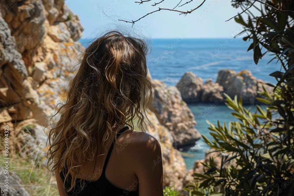 Poster Woman Sitting on Cliff Overlooking Ocean