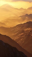 Mountain ridges bathed in the golden light of dawn