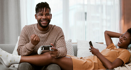 Black man, home and happy on sofa for video game with playing, fun and excited with winning....