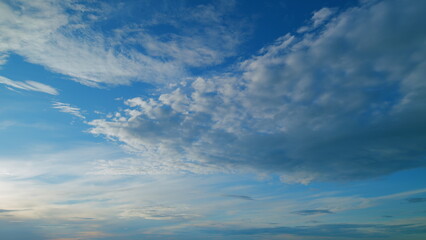 Warm colors of sky and clouds at sunset. Cloud nature background. Timelapse.