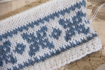Blue knitted pattern textured background.