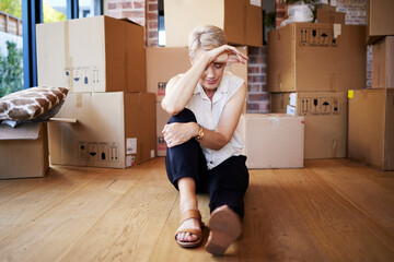 Mature woman, tired and boxes in new home, burnout and exhausted on floor, moving and sad for...