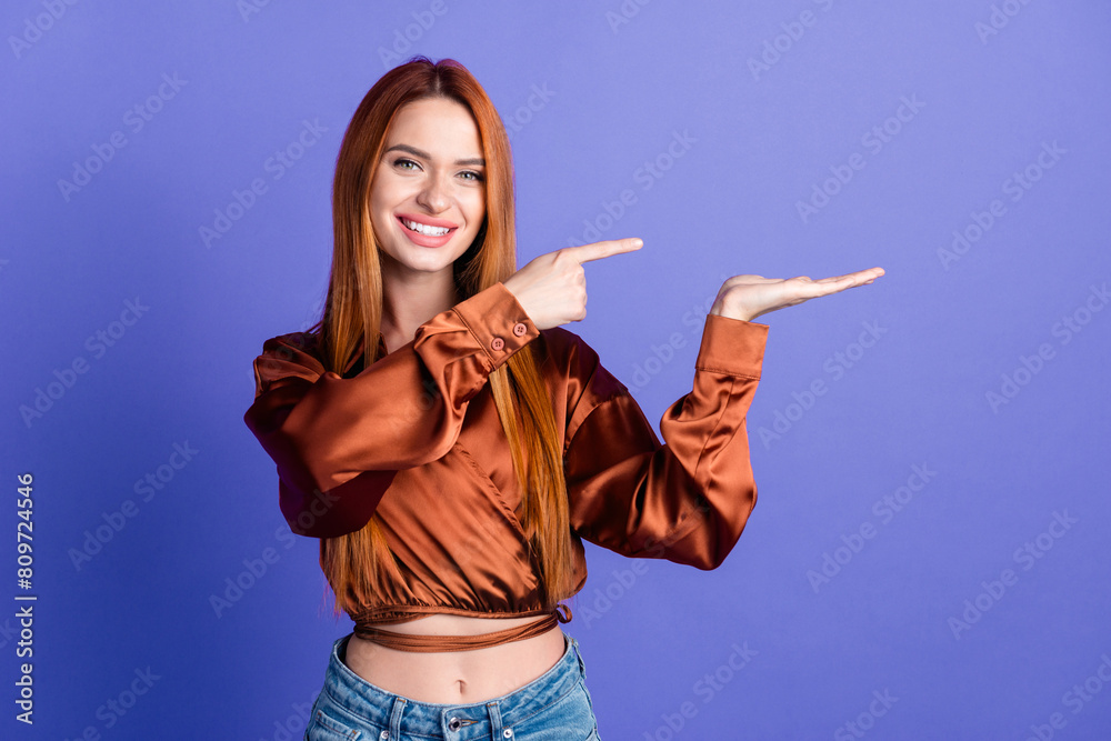 Canvas Prints photo of pretty young woman point finger arm hold empty space wear brown shirt isolated on violet co