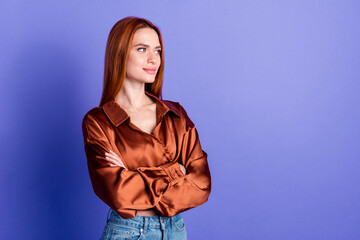 Photo of pretty young woman folded arms look empty space wear brown shirt isolated on violet color background