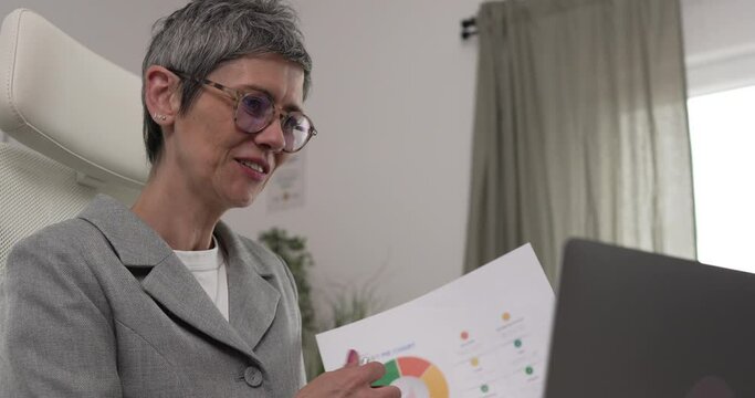 Mature woman share statistics have consultation via video call office