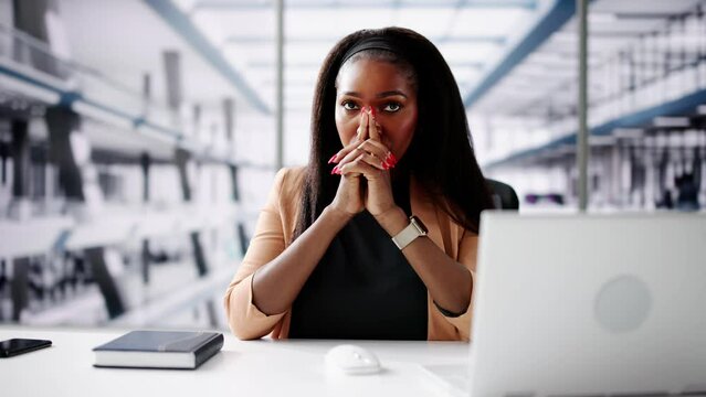 Contemplative Business Woman At Desk